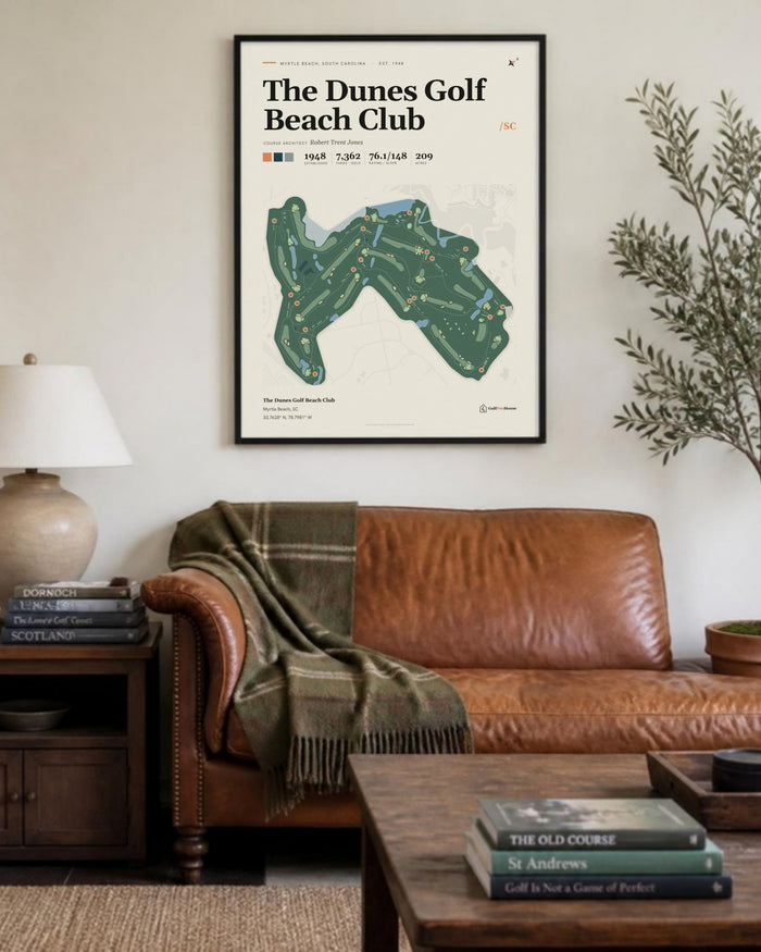 The Dunes Golf Beach Club golf course print, above a living room sofa